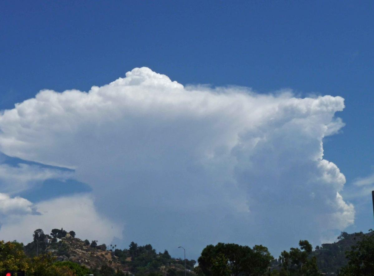 Towering thunderhead dwarfs Mt. Helix (right) and Grossmont Knoll (left) yesterday.